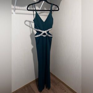 Emerald green form fitting long dress. Brand new with tags